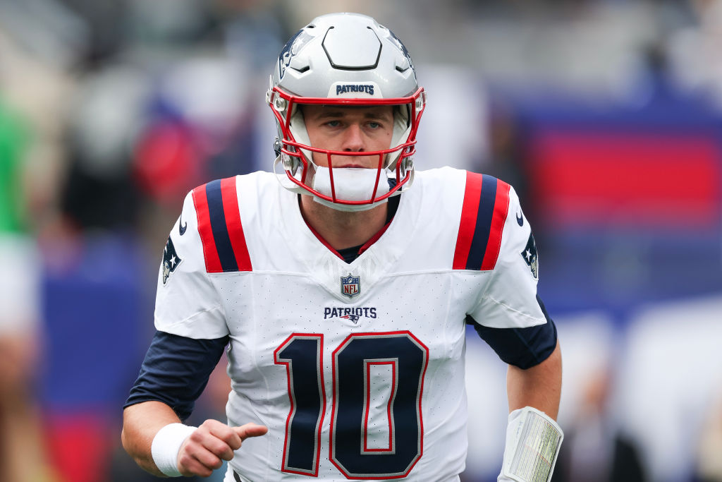 EAST RUTHERFORD, NEW JERSEY - NOVEMBER 26: Mac Jones #10 of the New England Patriots looks on prior to a game against the New York Giants at MetLife Stadium on November 26, 2023 in East Rutherford, New Jersey. (Photo by Al Bello/Getty Images)