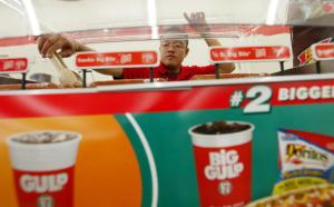 A store manager tends to 7-Eleven snacks at a Florida store.