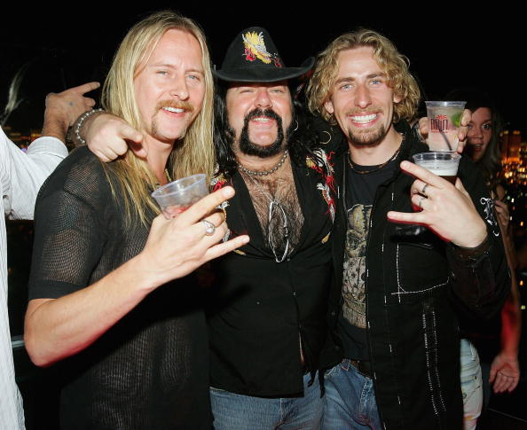 Birthday boy Jerry Cantrell shares a drink with Damageplan drummer Vinnie Paul and Nickelback frontman Chad Kroeger